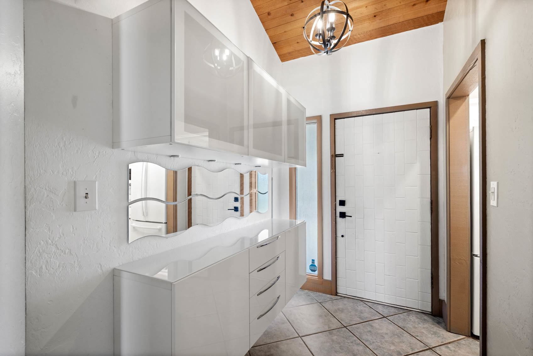 inside front door with white hallway